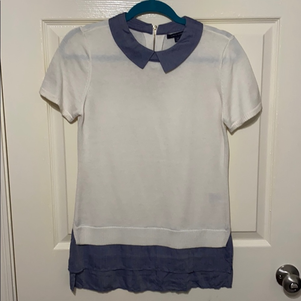 White knit shirt with blue collar and bottom